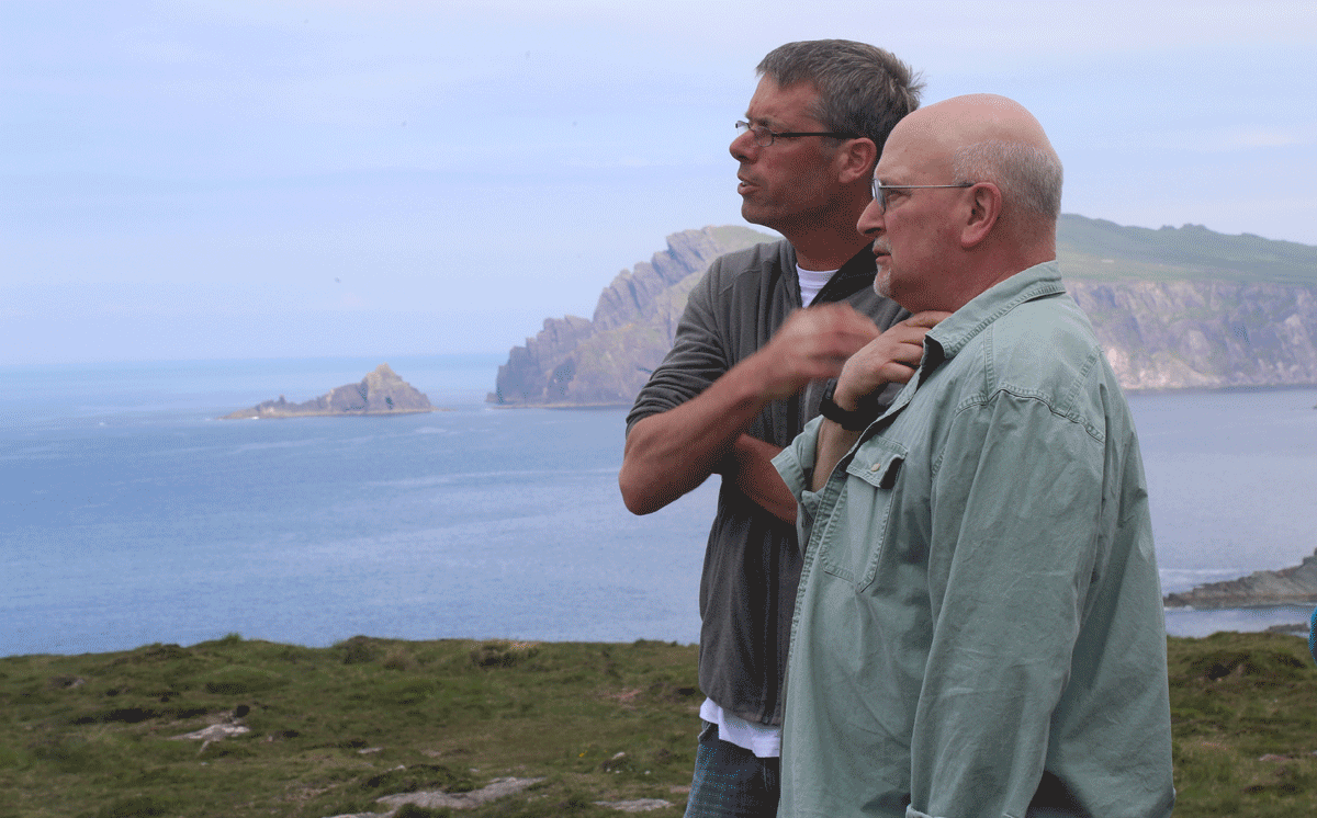 Kevin O'Shea (left) with a Thin Places Tour guest on the Western Edges tour