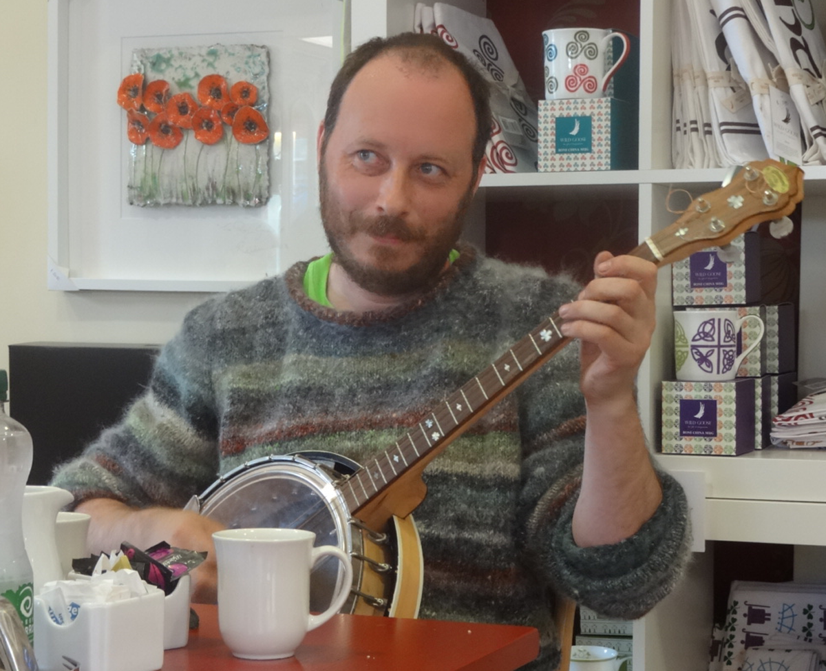 Martin Byrne plays his banjo at Drumcliffe